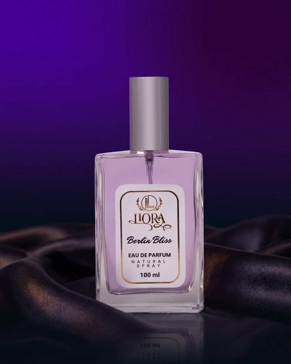 Berlin Bliss Eau de Parfum, lilac bottle on dark satin in evening light