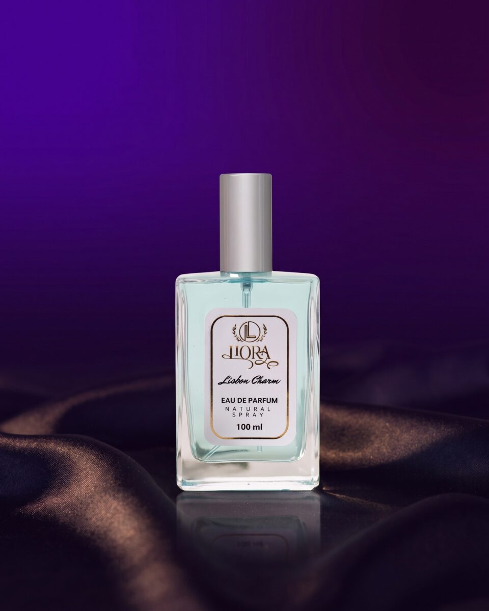 Lisbon Charm Eau de Parfum, pale aqua bottle on dark satin in evening light